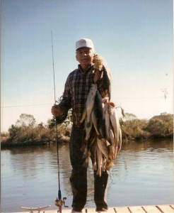 Capt. Cuz With A Stringer Of Speckled Trout