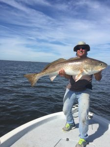 Capt. Clay With A Big Bull Red