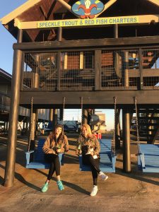 Two Beautiful Country Girls Relaxing Under The Cabins