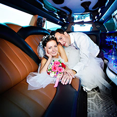 wedding couple inside a limousine