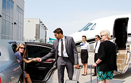grey limo outside of airport
