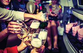 people toasting inside a limo